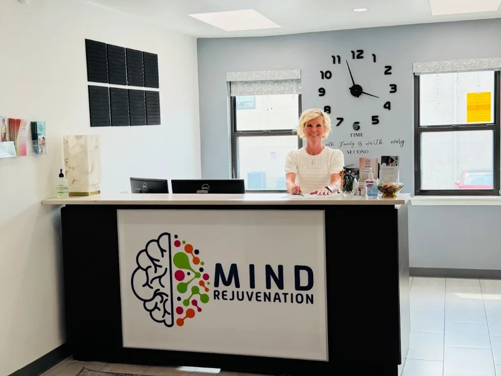 Friendly staff member at the Mind Rejuvenation front desk.